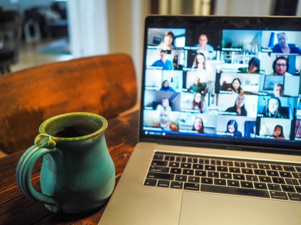 Remote employees collaborating using audiovisual technology