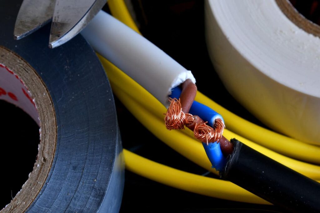 Spliced cables revealing copper wiring inside