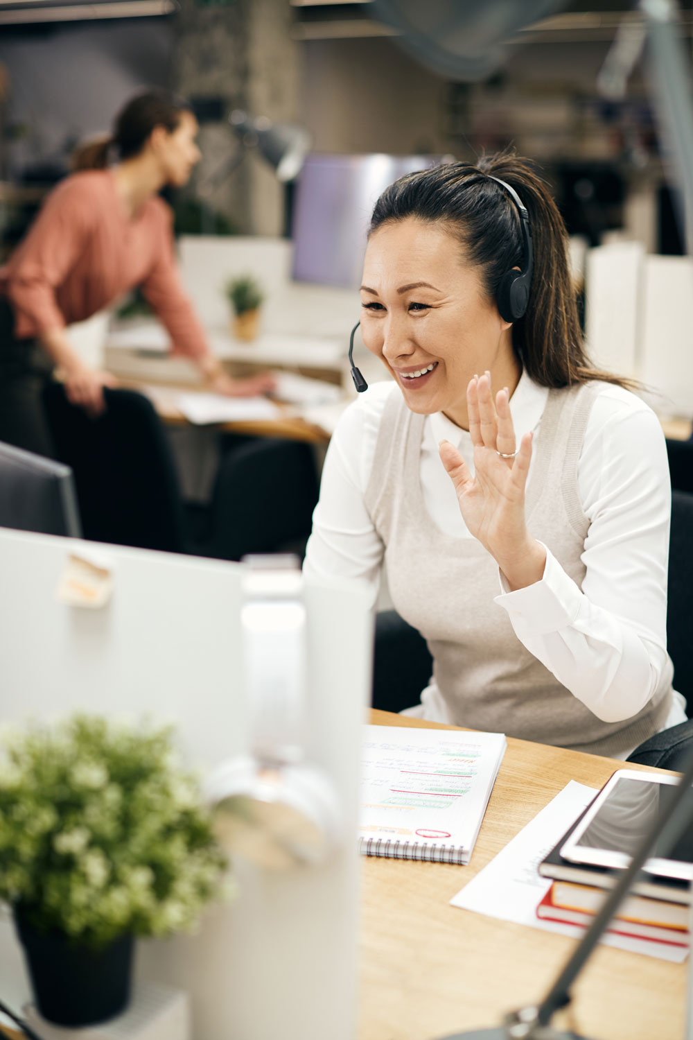 Employee using headset to conduct remote work