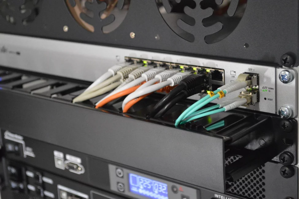 a data center rack with ethernet cables