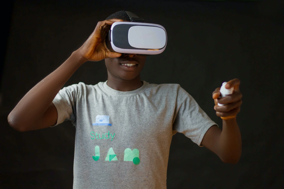 A young person smiling while wearing a vr headset