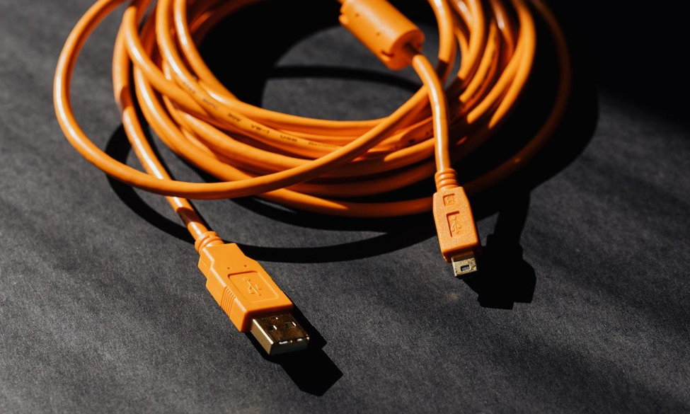 An orange hdmi to usb cable